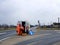 Two workers of the road service came to work on their official car to repair a broken road sign on the highway. Repair work. Road