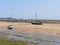 Two yachts beached at low tide in the Norfolk resort of Wells-next-the-Sea