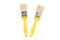 Two Yellow paintbrush isolated on a white background. Industrial paintbrush with wooden handle.