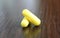 Two yellow pills lie on the table