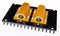 Two yellow power resistors bolted on black anodized aluminum heat sink on white background