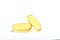 Two yellow soft gelatin capsules contain of fish oil supplement, isolated on white background.