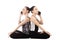 Two Yogi female talking on the mobile phone in yoga Lotus Pose