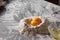 Two yolks and flour on the kitchen table. Ingredients for dough.