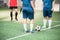 Two young active females in blue sports uniform standng in front of each other