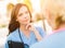 Two Young Adult Professional Female Doctors or Nurses Talking Outside.