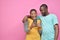 two young african friends, boy and girl, looking excited while viewing something on their smartphone together