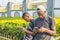 two young african males hanging out together outdoor together using their mobile phones, browsing the internet, texting