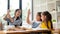 Two young Asian girls are enjoying studying English alphabet flashcards with a private teacher