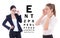 Two young attractive business women in eyeglasses and eye test c