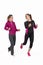 Two young attractive women in sports suits do morning jog