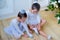 Two young ballet dancers preparing for lesson