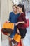 Two young beautiful girls criticizing store window