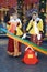 Two young beautiful ladies in traditional Russian clothes pose for photos