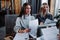 Two young beautiful women at a business meeting in a cafe