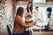 Two young beautiful women working together in office