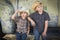Two Young Boys Wearing Cowboy Hats Leaning Against Antique Truck