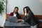 Two young business woman small company owners new business idea sitting in cafeteria trying and starting new project for online