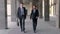 Two young businessmen walking to the office together