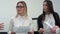 Two young businesswomen at the meeting in the office