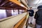 Two young carpenters working in big modern carpentry