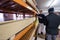 Two young carpenters working in big modern carpentry