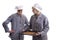 Two young cooks inspecting cookies on a plate