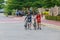 Two young cyclists with their bicycles walking together after bike touring at the dam.