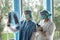 Two young doctors looking of xray image of lungs working in the hospital