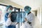 Two young doctors looking of xray image of lungs working in the hospital