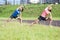 Two Young Feale Sportswomen Having Stretching Exercises