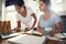 Two young female businesswomen doing research