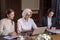 Two young female colleagues and their boss working together