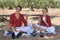 Two young flamenco dancers have a picnic in an olive grove in the typical flamenco costume