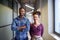 Two young founders pose in the office corridor