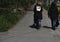 Two young girl walking together .two happy dressy girls running on spring walk, back view, friendship concept