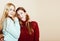 Two young girlfriends in winter sweaters indoors having fun. Lif