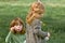 Two young girls blowing bubbles