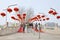 Two young girls on a bridge with red lanterns, Beijing, China.