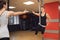 Two young girls do fly yoga and stretches in the studio.