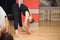 Two young girls do fly yoga and stretches in the studio.