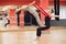 Two young girls do fly yoga and stretches in the studio