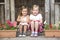 Two Young Girls Playing in Wooden House