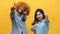 Two young girls showing thumbs up. African american black and asian colleagues