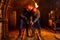 Two young guys in a working uniform and protective helmets, carry out work in the mine