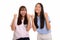 Two young happy Asian teenage girls smiling and both looking mot