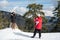 Two young happy teenage taking photos with a mobile phone on a snowy mountain