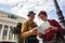 Two young hikers are looking at the map