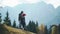 Two young hipsters traveling together in highlands. Happy person huging and kissing while hiking on mountain or hill