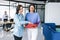 Two young hispanic businesswomen reviewing documents at workplace in Mexico City